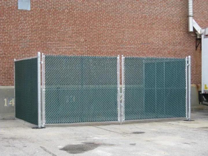 Commercial chain link enclosure with green privacy slats — fencing options for Salem and Southern NH